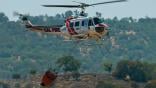 Cal Fire UH-1H Super Huey above a wildfire