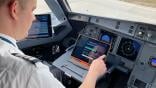 pilot at flight controls